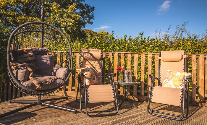 Ash Lodge sun loungers and swing chair.